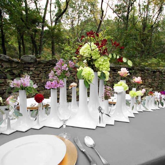 luxury wedding tablescape with white ceramic vases
